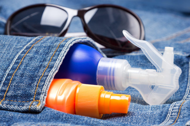 Ultraviolet Rays and Sunscreens sunscreen bottles in jean's pocket and sunglasses