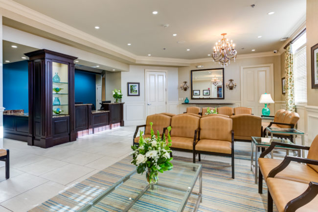Derick Dermatology Barrington, Illinois Barrington location waiting area, chairs, desk, chandelier