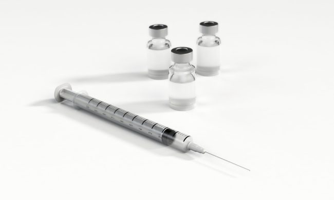 syringe with needle and 3 medicine vials used for ILK injections