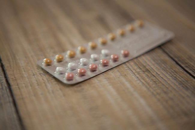 birth control pills in packet on a table