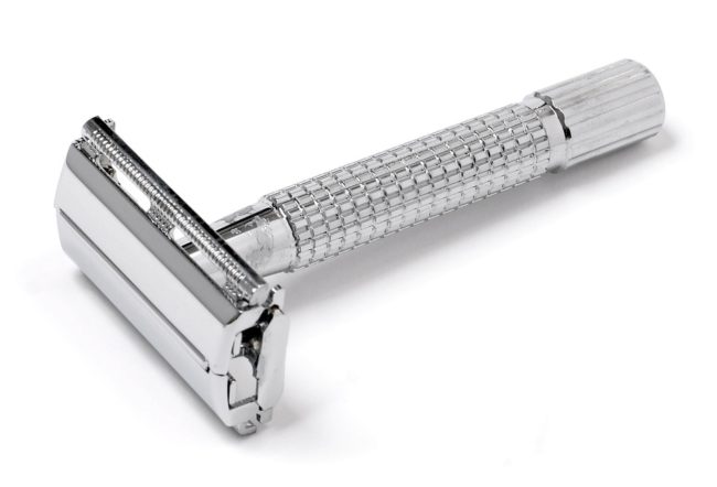 Shaving: Can’t Live with It, Can’t Live Without It image of a safety razor used for shaving